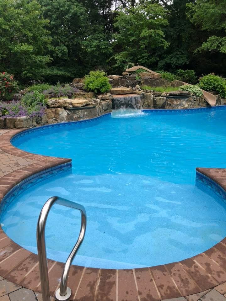 Same pool restored to crystal blue with waterfall running