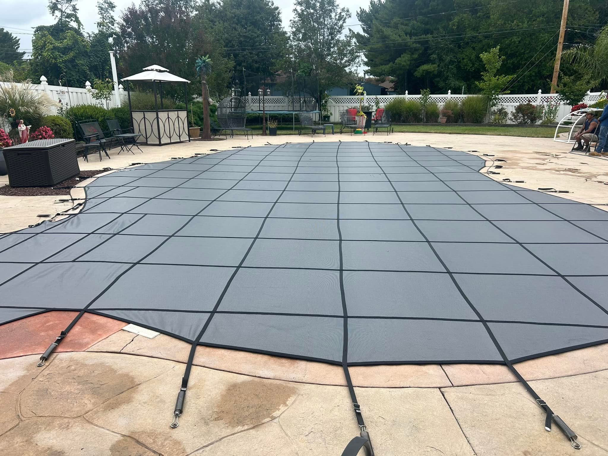 Custom-fit safety cover on large freeform pool